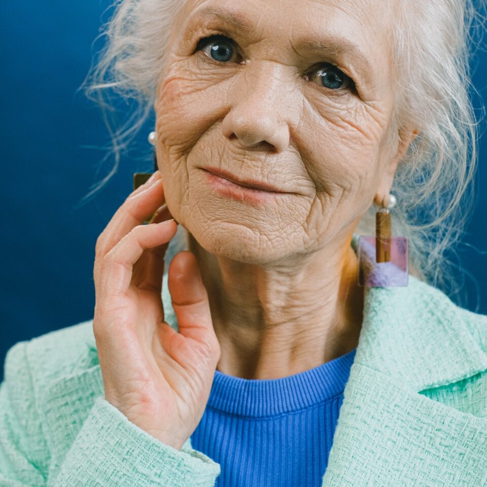 Beautiful elderly woman with flawless, radiant skin thanks to foundation for mature and dry skin